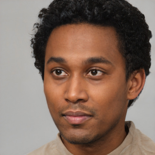 Neutral black young-adult male with short  black hair and brown eyes
