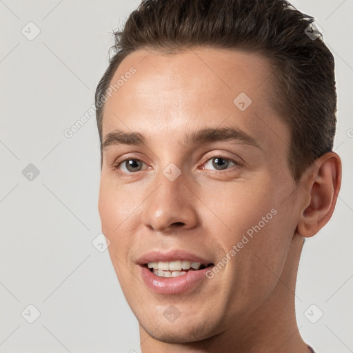 Joyful white young-adult male with short  brown hair and brown eyes