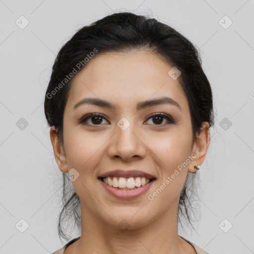 Joyful latino young-adult female with long  brown hair and brown eyes