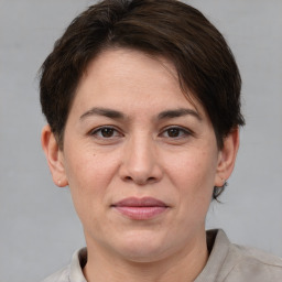 Joyful white adult female with short  brown hair and brown eyes