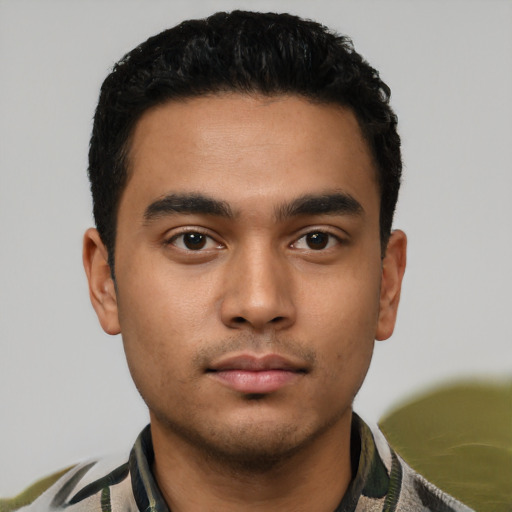 Neutral latino young-adult male with short  black hair and brown eyes
