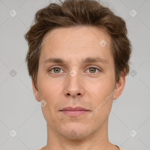 Joyful white adult male with short  brown hair and grey eyes