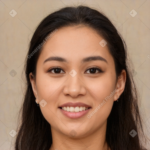 Joyful latino young-adult female with long  brown hair and brown eyes