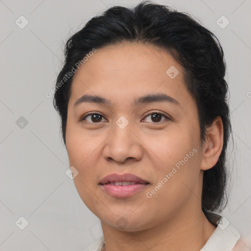 Joyful latino young-adult female with medium  brown hair and brown eyes