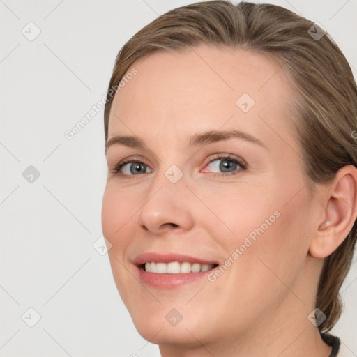 Joyful white young-adult female with medium  brown hair and blue eyes