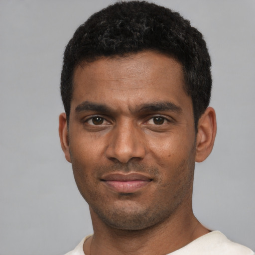 Neutral black young-adult male with short  black hair and brown eyes
