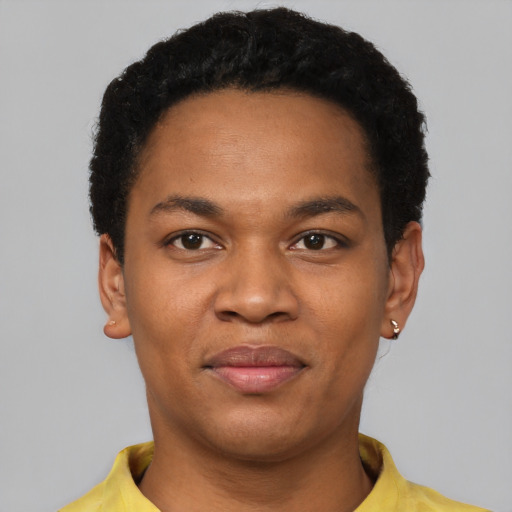 Joyful black young-adult male with short  black hair and brown eyes