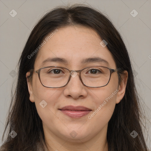 Joyful white adult female with long  brown hair and brown eyes