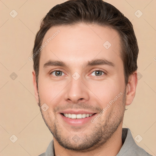 Joyful white young-adult male with short  brown hair and brown eyes