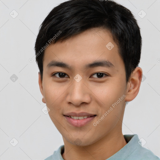 Joyful asian young-adult male with short  brown hair and brown eyes