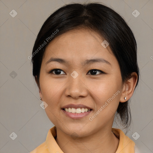 Joyful asian young-adult female with medium  brown hair and brown eyes