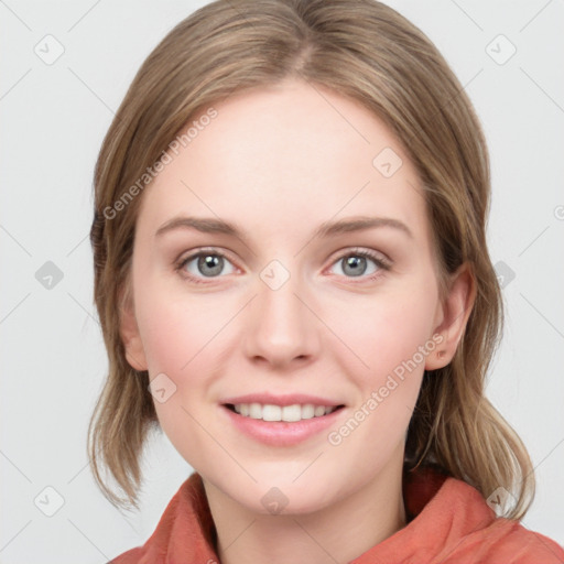 Joyful white young-adult female with medium  brown hair and blue eyes