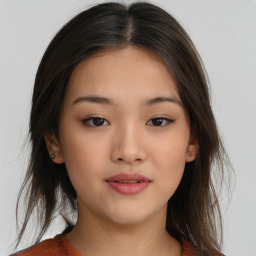 Neutral asian young-adult female with medium  brown hair and brown eyes