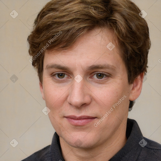 Joyful white adult male with short  brown hair and grey eyes