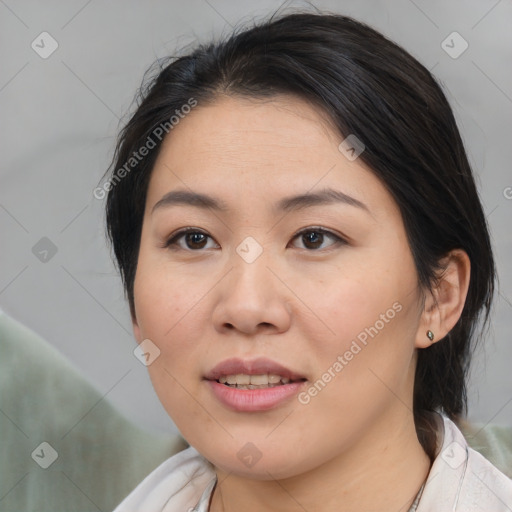 Joyful asian young-adult female with medium  brown hair and brown eyes