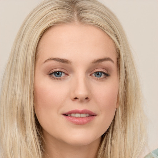 Joyful white young-adult female with long  brown hair and green eyes