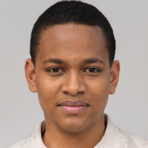 Joyful latino young-adult male with short  brown hair and brown eyes