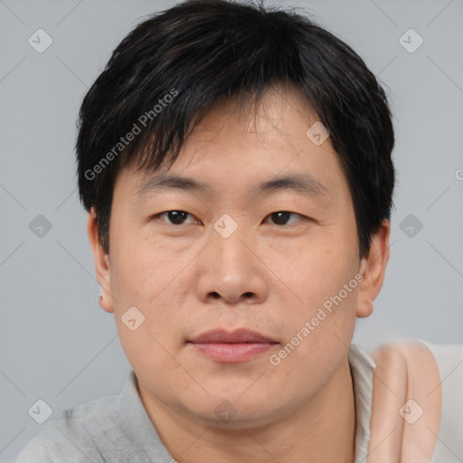 Neutral asian young-adult male with short  brown hair and brown eyes