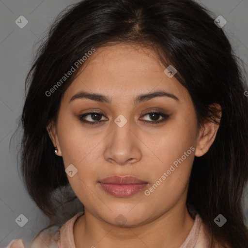 Joyful latino young-adult female with medium  brown hair and brown eyes