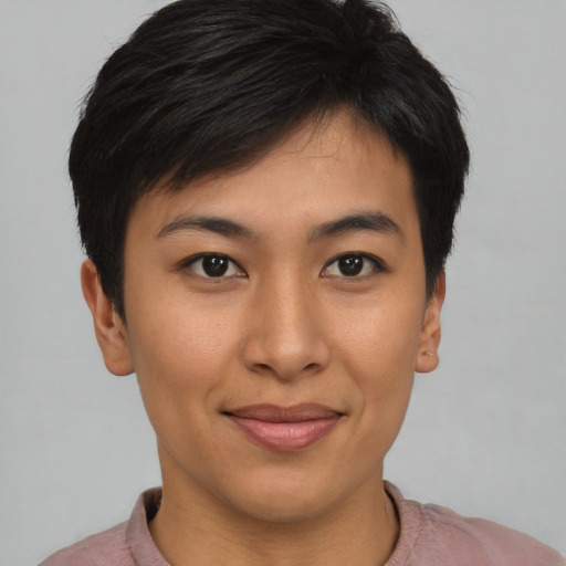 Joyful asian young-adult female with short  brown hair and brown eyes