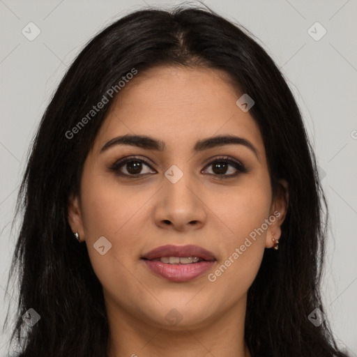 Joyful latino young-adult female with long  brown hair and brown eyes