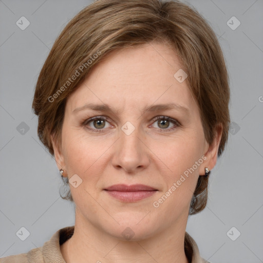 Joyful white adult female with medium  brown hair and grey eyes