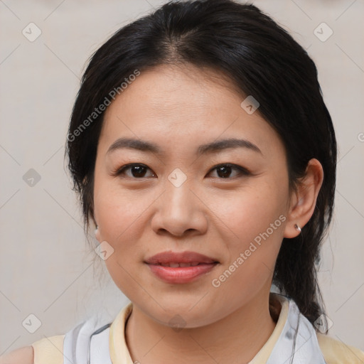 Joyful asian young-adult female with medium  brown hair and brown eyes