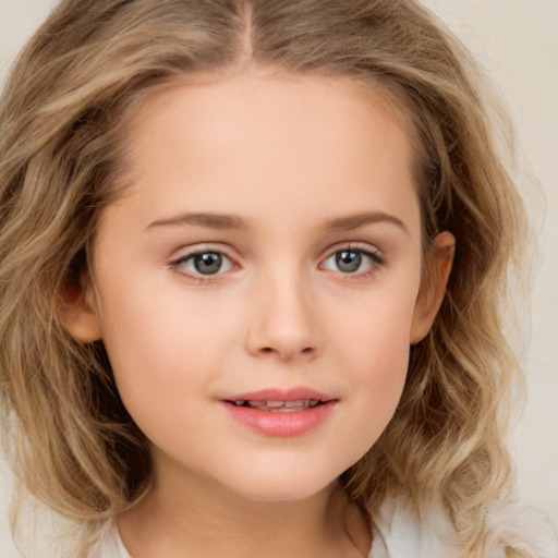 Joyful white child female with long  brown hair and brown eyes