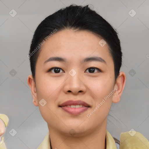 Joyful asian young-adult female with short  black hair and brown eyes