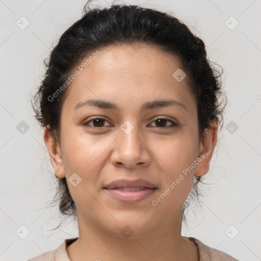 Joyful latino young-adult female with short  brown hair and brown eyes