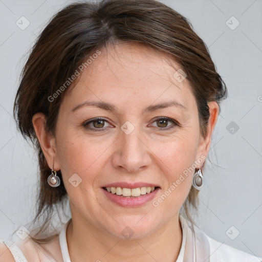 Joyful white adult female with medium  brown hair and grey eyes