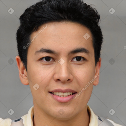 Joyful latino young-adult male with short  brown hair and brown eyes