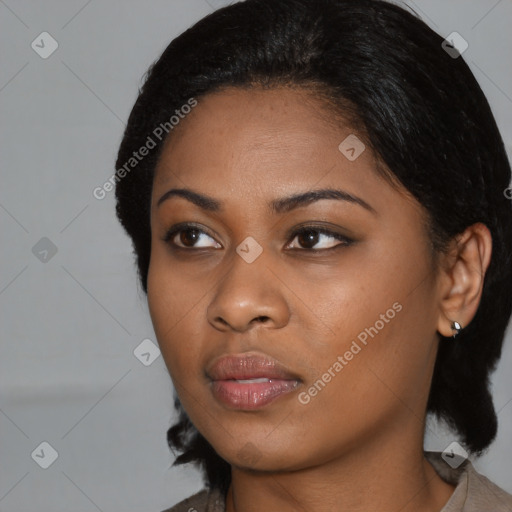 Joyful black young-adult female with medium  black hair and brown eyes