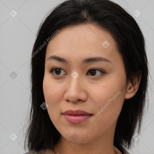 Joyful asian young-adult female with medium  brown hair and brown eyes