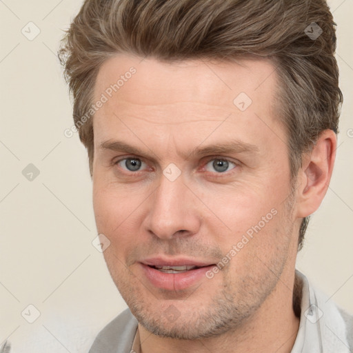 Joyful white adult male with short  brown hair and brown eyes