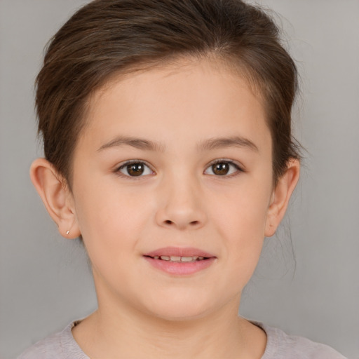 Joyful white child female with short  brown hair and brown eyes