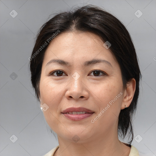 Joyful white adult female with medium  brown hair and brown eyes