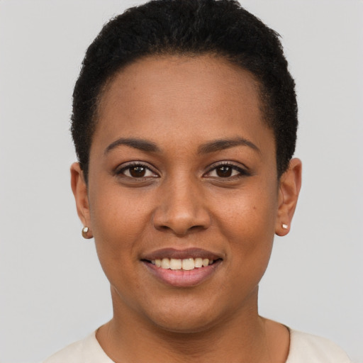 Joyful black young-adult female with short  brown hair and brown eyes