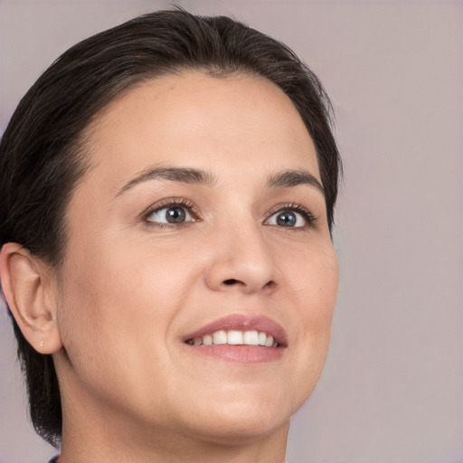 Joyful white young-adult female with medium  brown hair and brown eyes