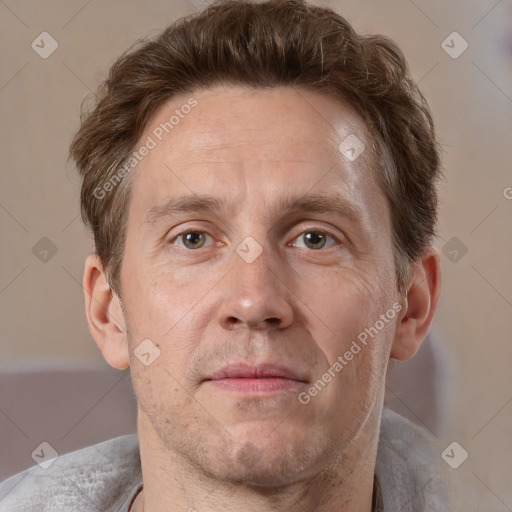 Joyful white adult male with short  brown hair and grey eyes