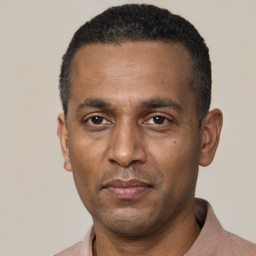 Neutral black adult male with short  black hair and brown eyes