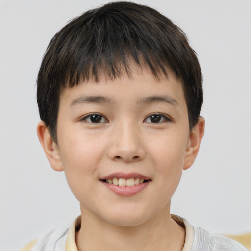 Joyful white child male with short  brown hair and brown eyes