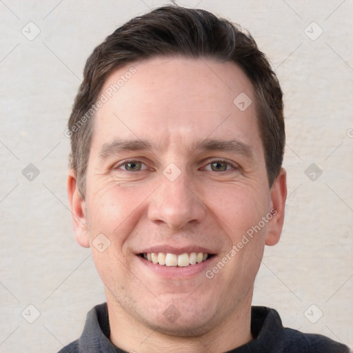 Joyful white adult male with short  brown hair and brown eyes