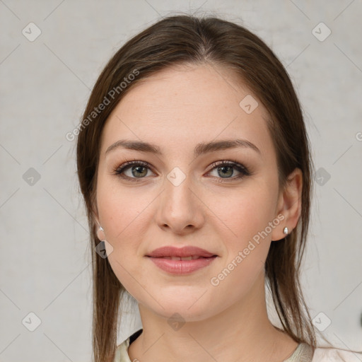 Joyful white young-adult female with medium  brown hair and green eyes