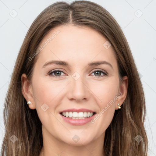 Joyful white young-adult female with long  brown hair and grey eyes