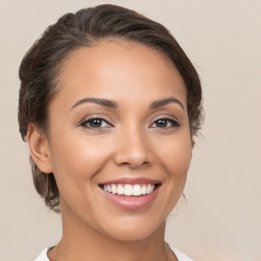 Joyful white young-adult female with medium  brown hair and brown eyes