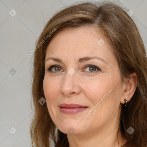 Joyful white adult female with medium  brown hair and brown eyes