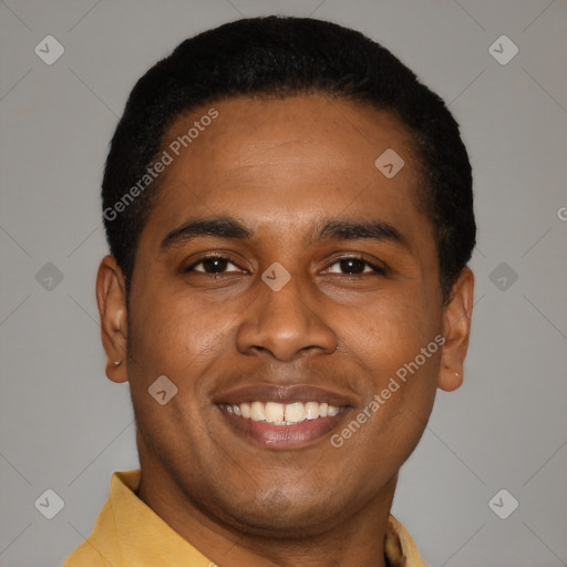 Joyful latino young-adult male with short  black hair and brown eyes
