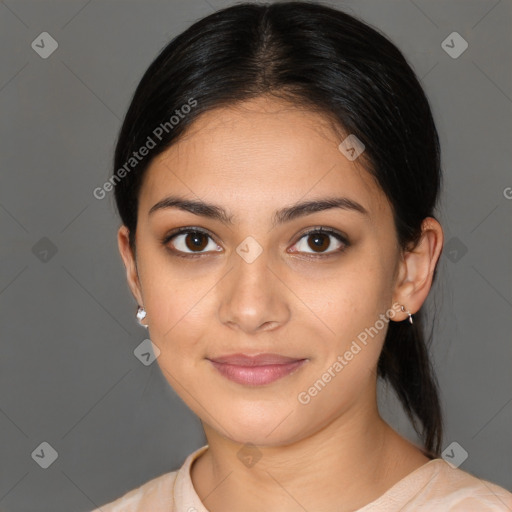 Joyful latino young-adult female with medium  brown hair and brown eyes