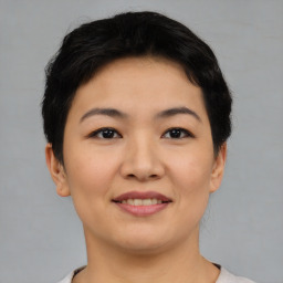 Joyful asian young-adult female with short  brown hair and brown eyes